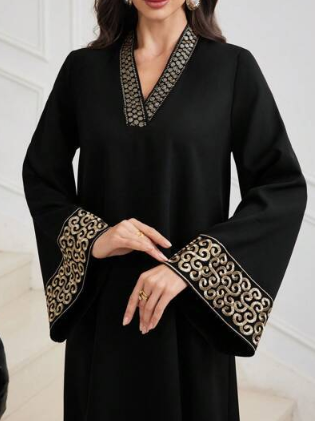 Embroidered retro puff-sleeve V-neck dress by Undefyning Lynes, featuring artistic embroidery on elegant vintage-inspired fabric.