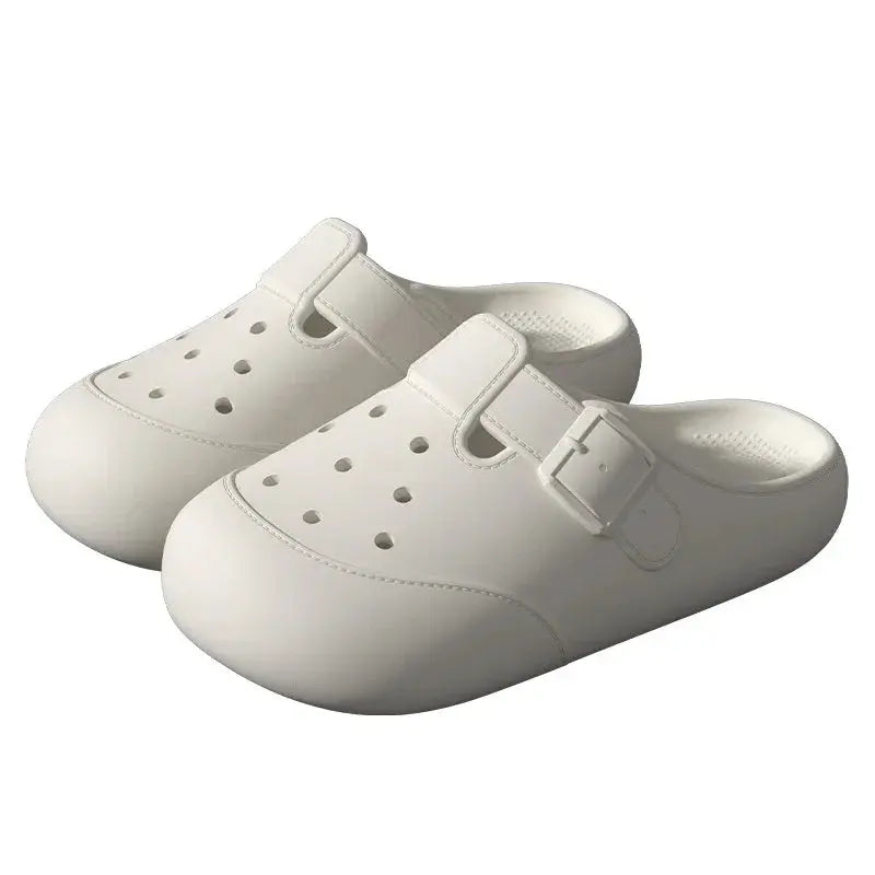 White slip-on clogs with buckle strap and ventilation holes, fashion footwear