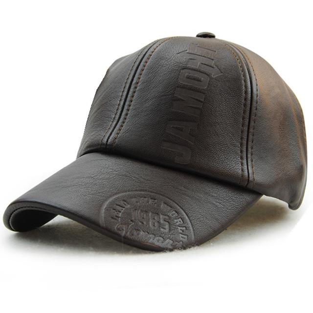 Embossed Leather Flat Cap — side profile with emblem detail