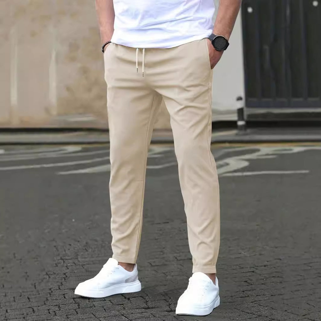 Cropped trousers in khaki worn with a plain tee