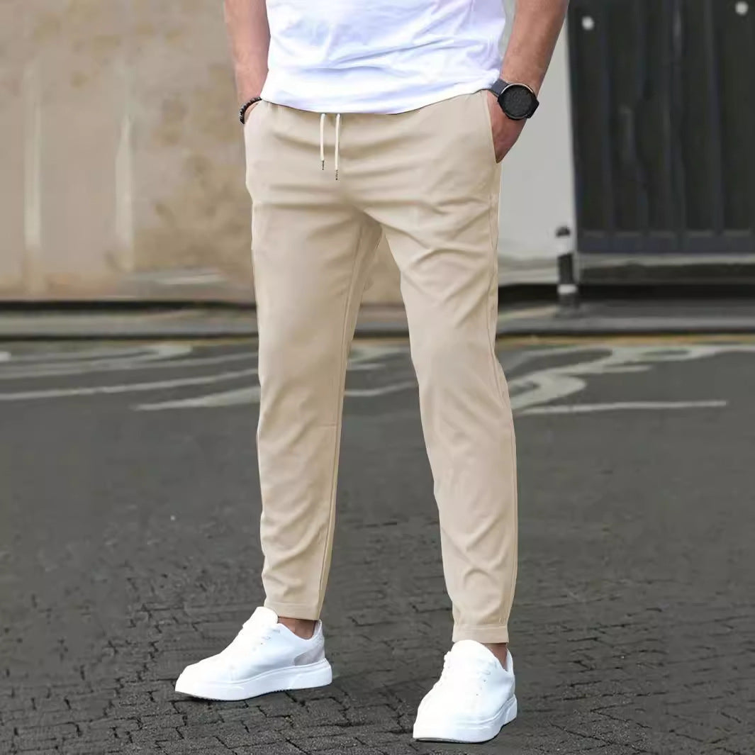 Cropped trousers in khaki worn with a plain tee