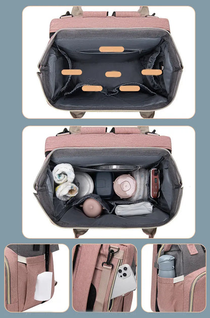 Pink diaper bag backpack showing large organized interior, side bottle pocket, and back phone storage.