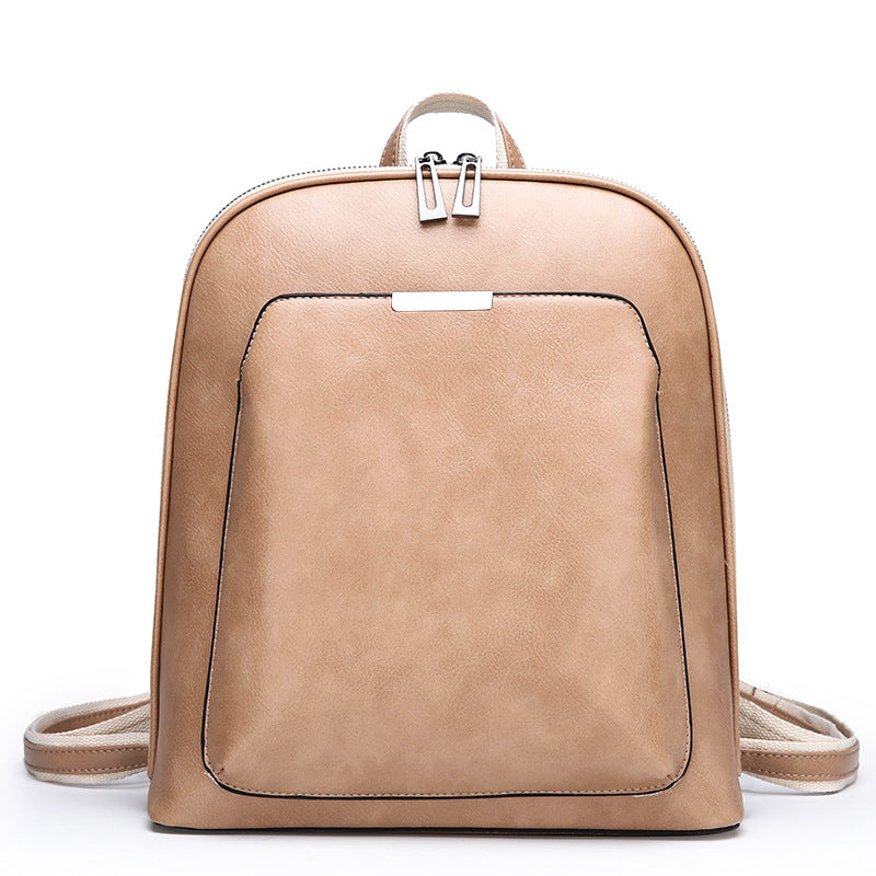 Structured PU Leather Backpack — worn on shoulder, lifestyle shot