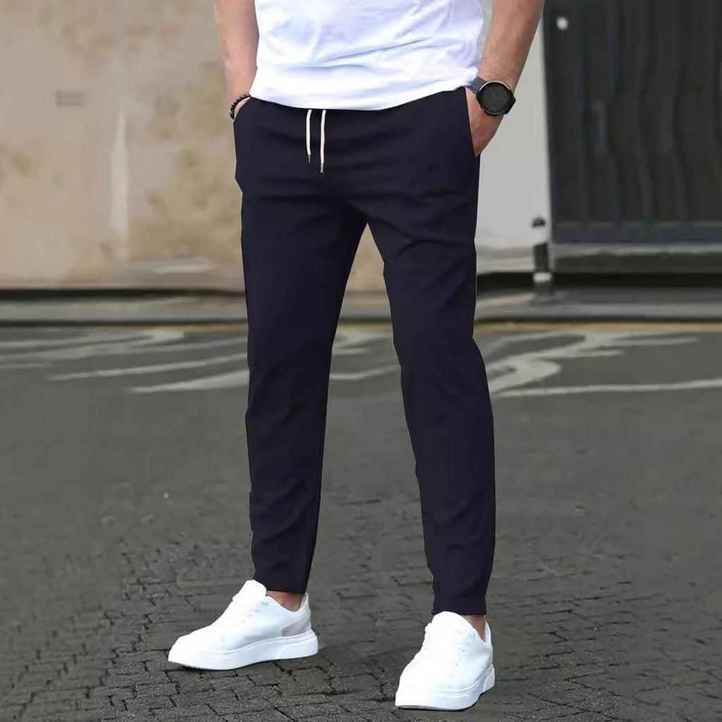 Cropped trousers shown from the side showing the ankle break