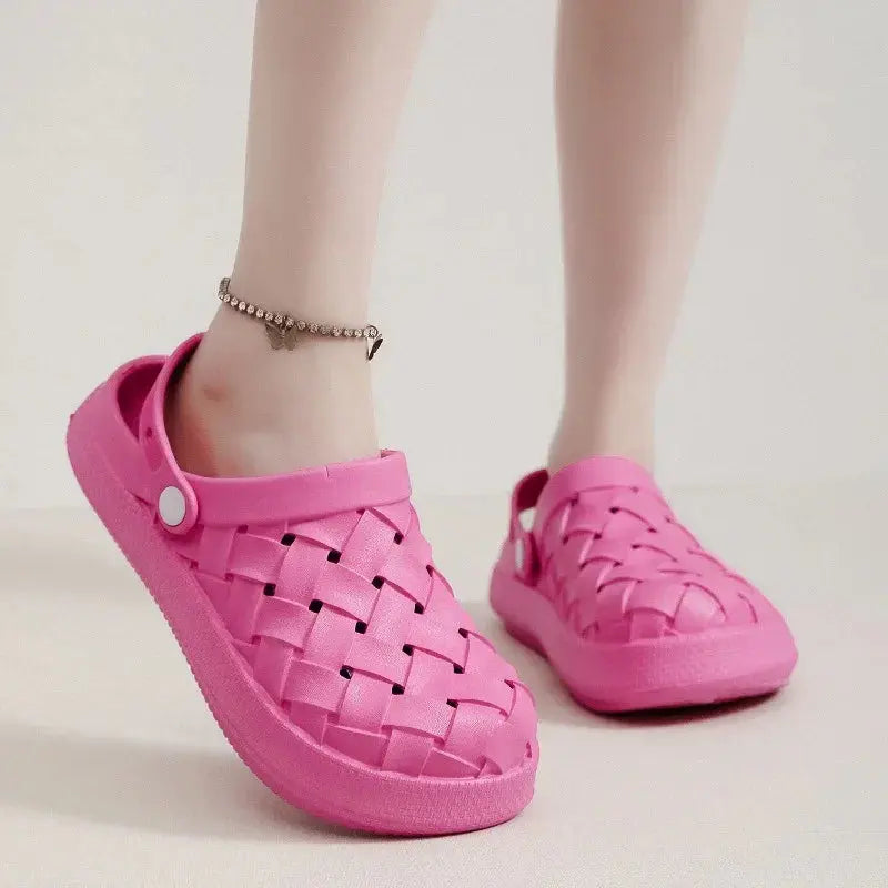 Pink woven clogs with back strap, comfortable slip-on sandals, worn by a model