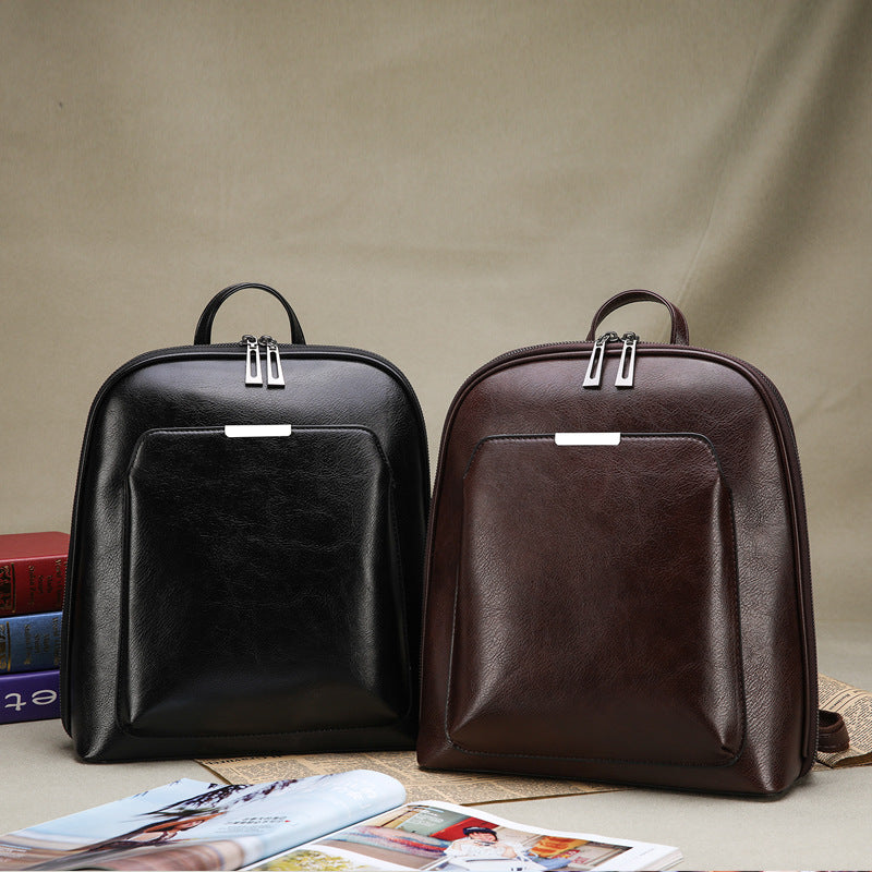 Structured PU Leather Backpack — side view showing structured silhouette