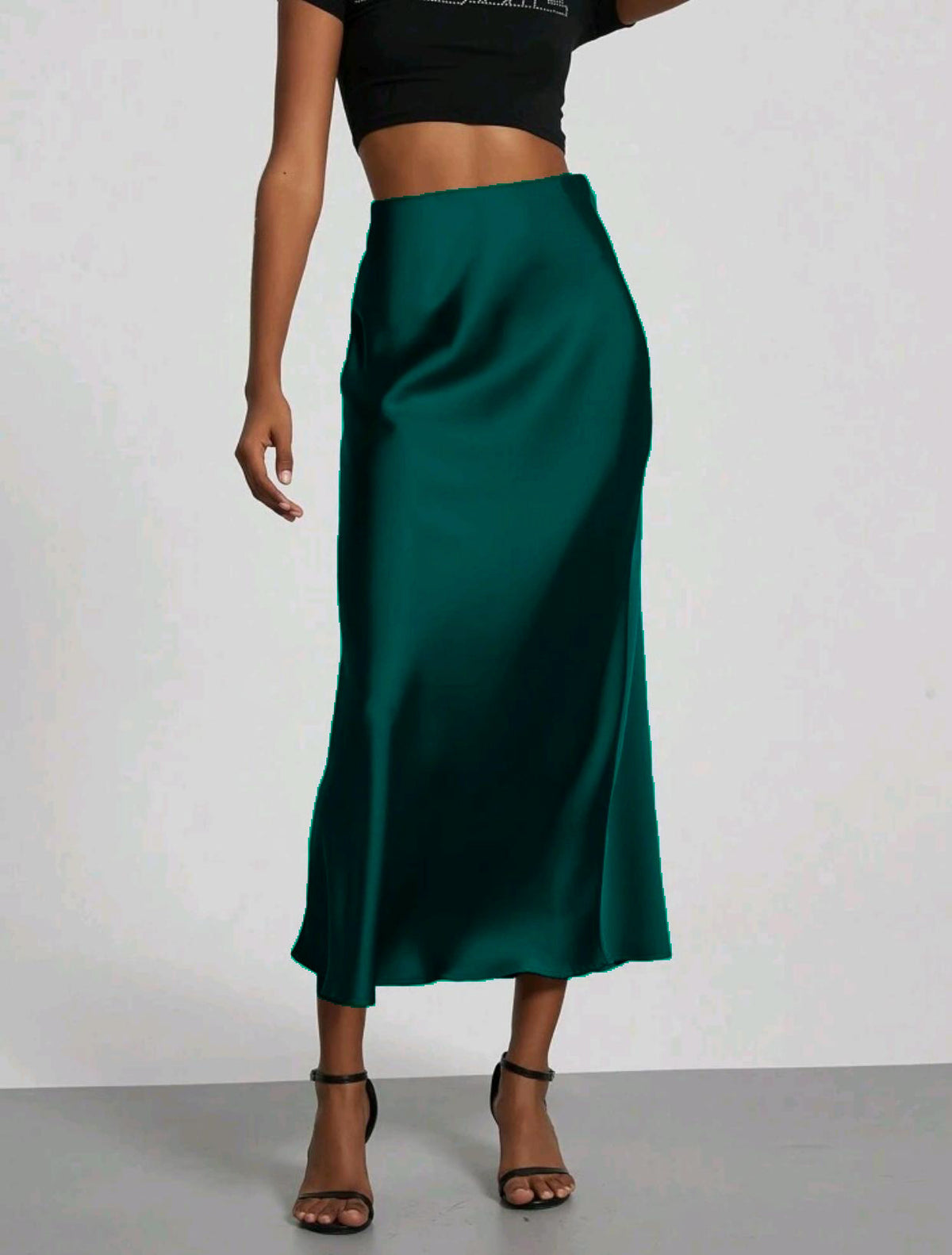 Satin midi skirt shown from the side showing the column line