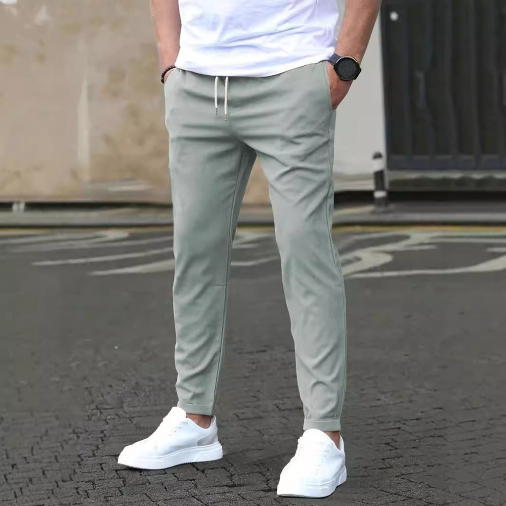 Slim fit cropped trousers in black, front view