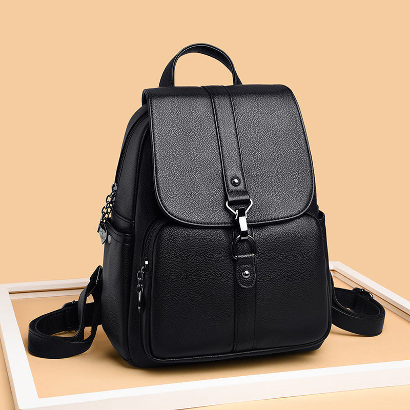Undefyning Lynes black sheepskin leather backpack with a vertical square silhouette and front buckle closure.