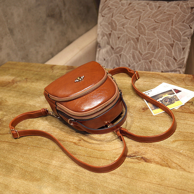 Undefyning Lynes brown oil wax leather convertible shoulder bag with bee embellishment and adjustable strap