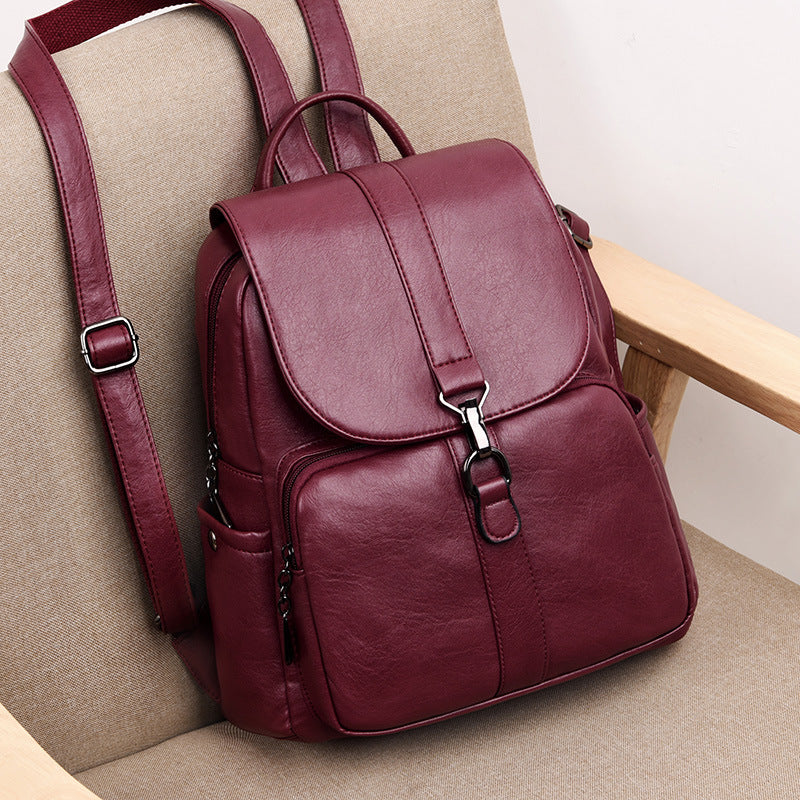 Undefyning Lynes vertical backpack in deep burgundy sheepskin leather with a flap closure and metal hardware