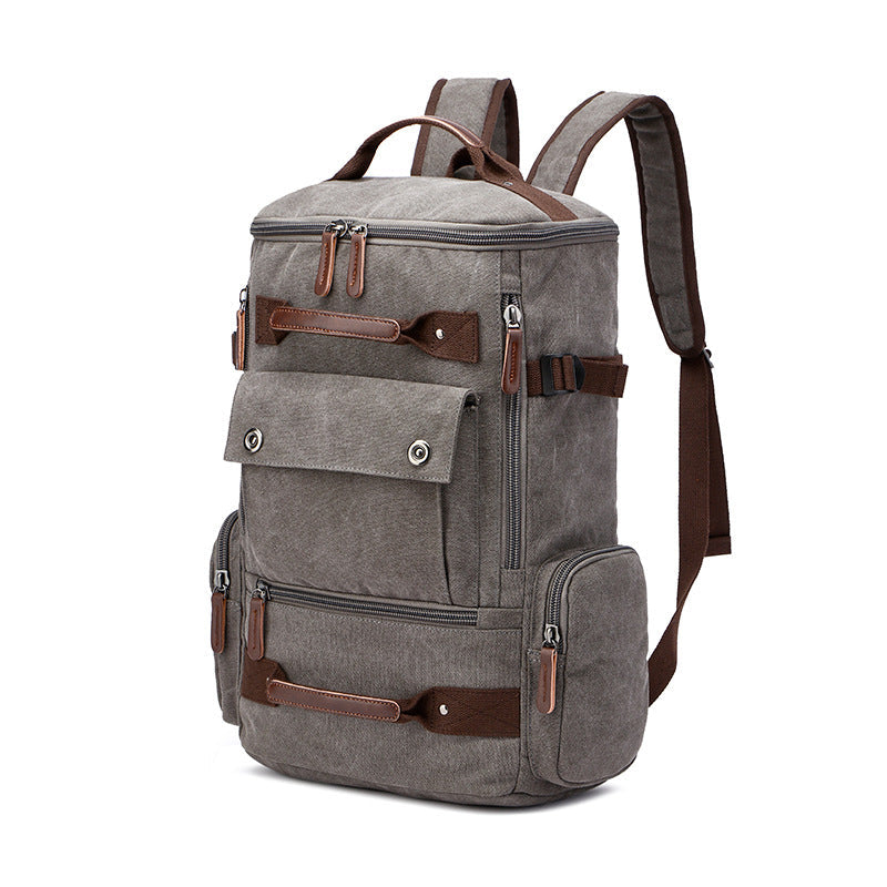 Undefyning Lynes vintage grey washed canvas laptop backpack with brown microfiber leather trim and multiple pockets.