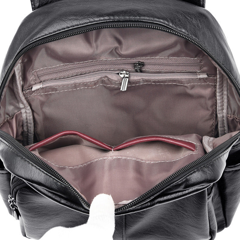 Undefyning Lynes black sheepskin leather backpack interior with zippered pocket and slip compartments