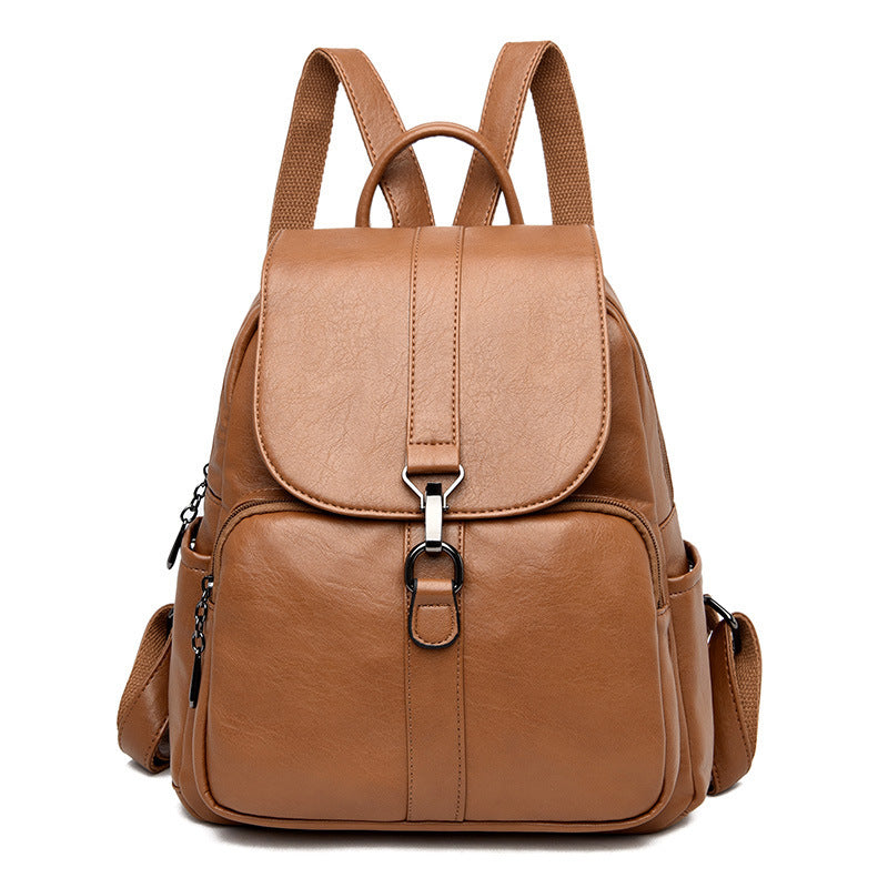 Undefyning Lynes soft tan sheepskin leather backpack with a vertical square silhouette and front buckle closure.